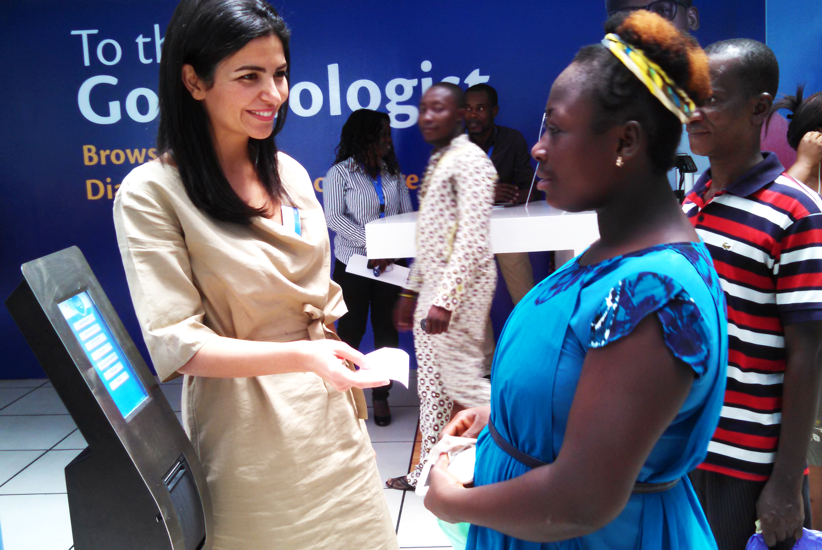 Tigo Ghana CEO Roshi Motman helping customers