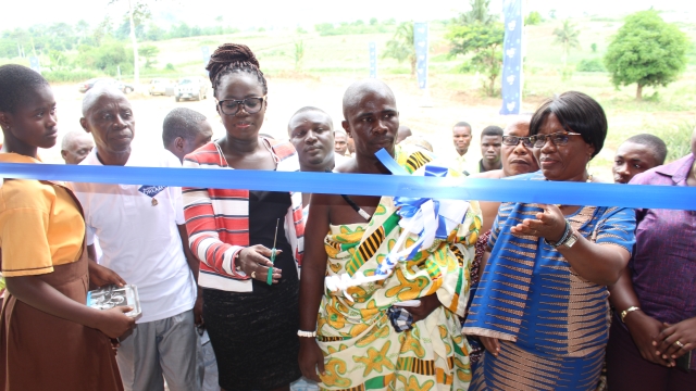 © (L-R) Osman Esuon (in white shirt), Headmaster of Tupaa Basic School; Gifty Bingley, Head of Corporate Communications and CSR, Tigo Ghana; Nii Philip Anartey, representative of the Chief of Tupaa and Margaret Frimpong, Municipal Education Director